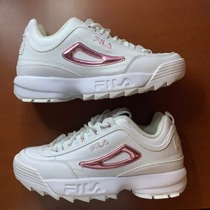 White Filas with bright pink detail